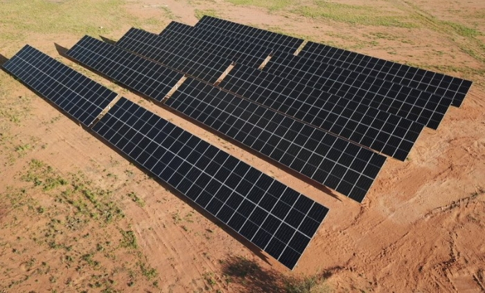 Free-standing-solar-panels-brown-dirt